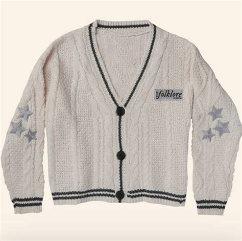 Buy the cardigan (Official Merchandise) by Taylor Swift (US Import) online today! cream cable knit cardigan with black matte buttons, dark gray trim, light gray star embroidery on both arms, and light gray album title patch on left chest with dark grey font. 50% acrylic yarn 50% polyester taylor seen wearing m/l in the “cardigan” music video taylor swift® …